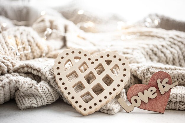 A decorative heart among cozy knitted items valentines day holiday concept