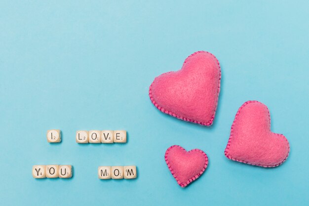 Decorative hearts near I love you mom title