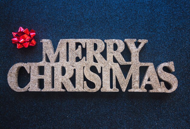 Decorative merry Christmas title with bow 