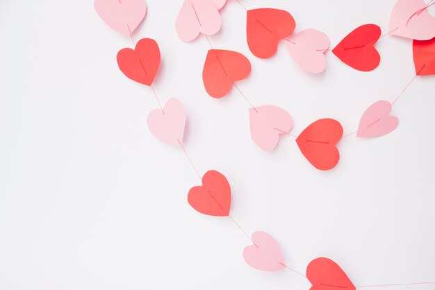 Decorative paper hearts on threads 