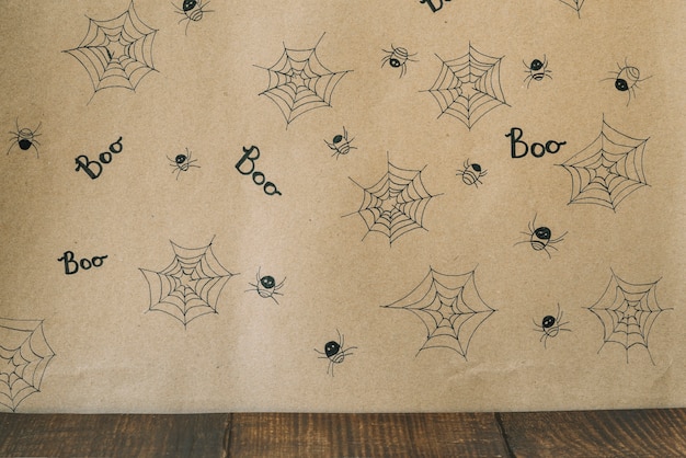 Free photo decorative pictured spiders with cobweb and inscription