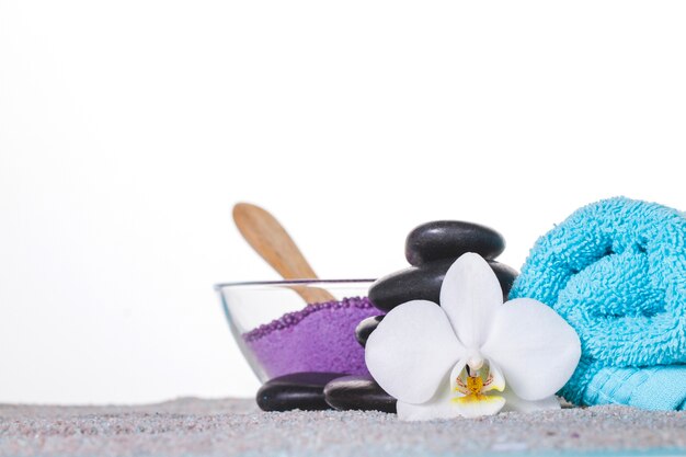 Decorative spa elements on grey towel