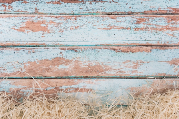 Decorative straw on blue wooden table