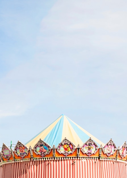 Decorative tent against blue sky at funfair