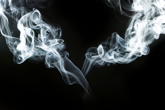 Decorative wavy silhouettes of smoke