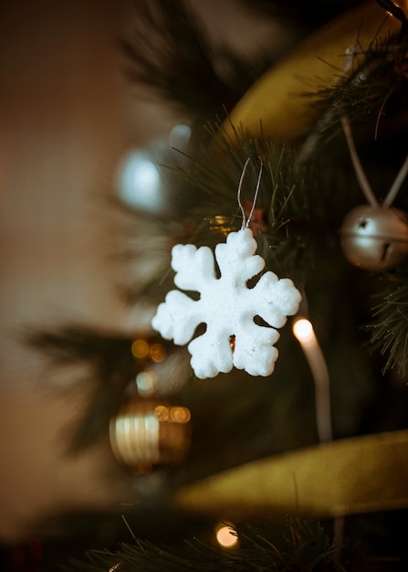 Decorative white snowflake on Christmas tree