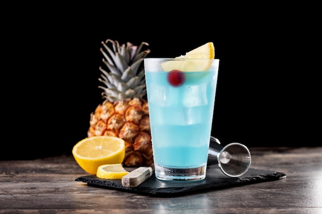 Deep blue sea martini cocktail on wooden table