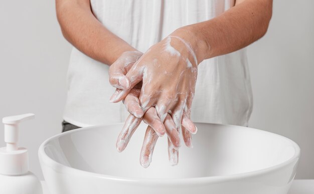 Deep cleaning the hands with water and soap