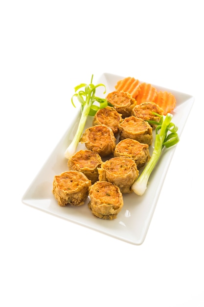 Free photo deep fried crab meat roll in white plate