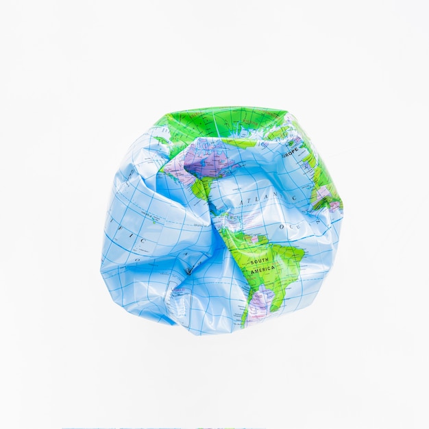 Deflated ball with Earth map