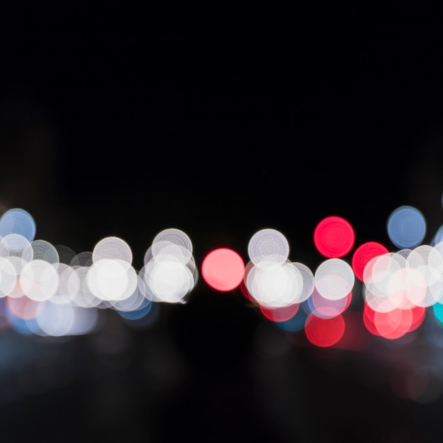 Defocused bokeh of colorful lights at night