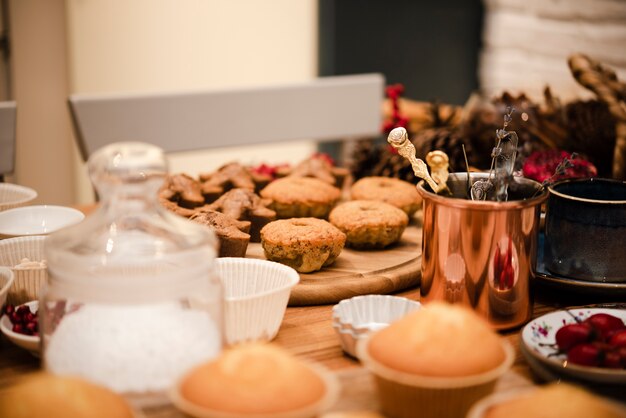 Defocused cupcakes with powdered sugar in jar