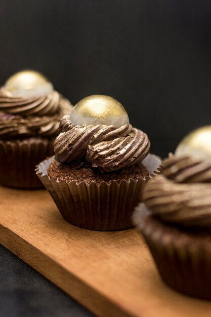 Defocused cupcakes on wooden board