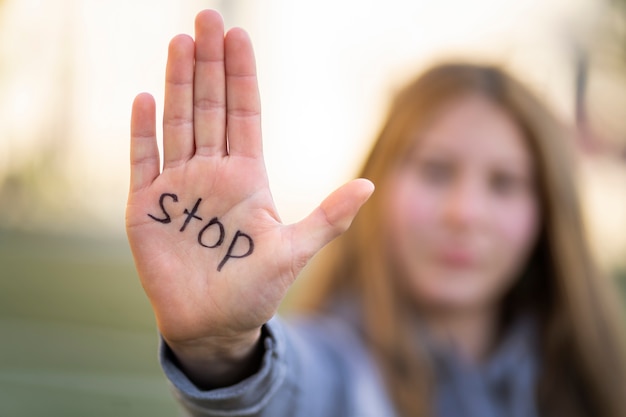 Defocused person protesting with writing on hand for world environment day outdoors