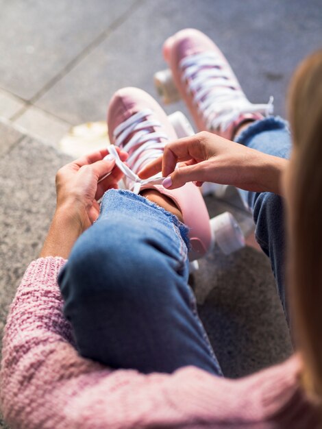 Defocused roller skates with woman in jeans