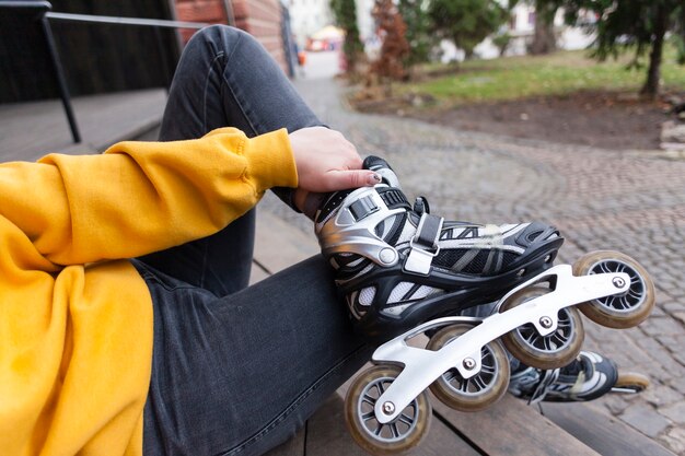 Defocused woman wearing roller blades