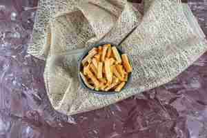 Free photo delectable crispy breadcrumbs in a bowl on a tablecloth, on the marble table.