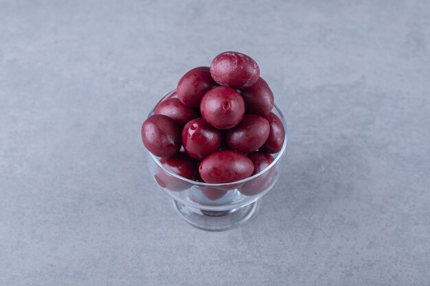 Delectable pickled plum , on the marble background