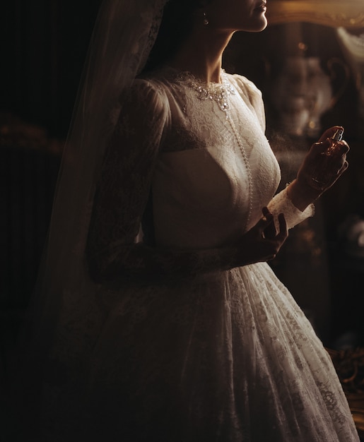 Delicate pearls on bride's beautiful dress