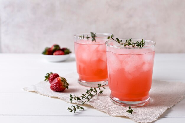 Delicious alcoholic drinks with strawberries