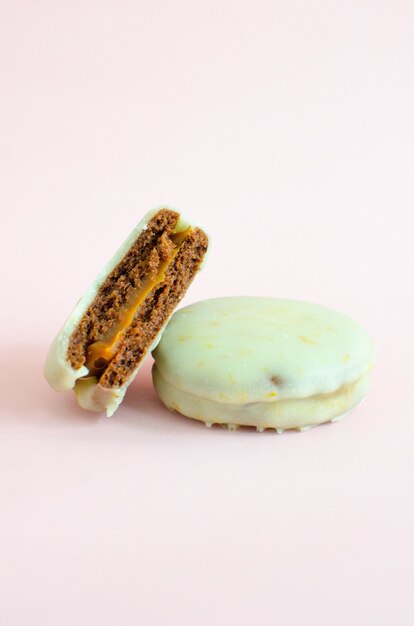 Delicious and appetizing cookie with chocolate cream on white background