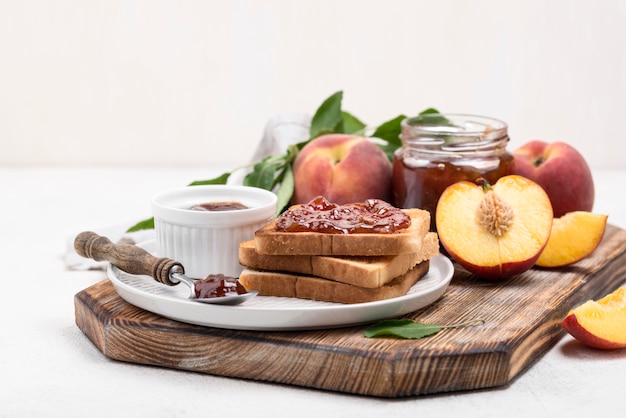 Delicious apricots jam on wooden board