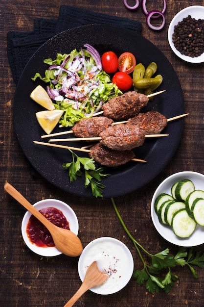 Delicious arabic fast-food meat on skewers top view