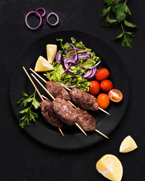 Delicious arabic fast-food meat on skewers and veggies