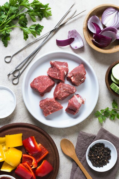 Delicious arabic fast-food pieces of uncooked meat on plate