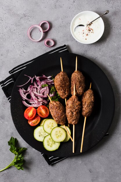 Delicious arabic fast-food skewers and veggies