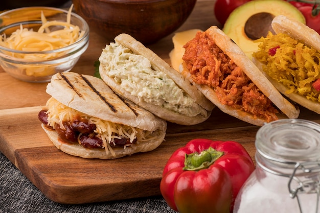 Free photo delicious arepas on wooden board