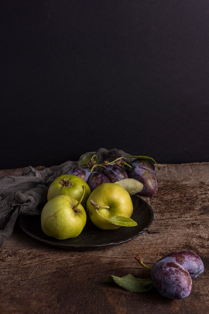 Delicious autumn fruits on plate