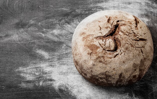 Delicious baked loaf with flour high view