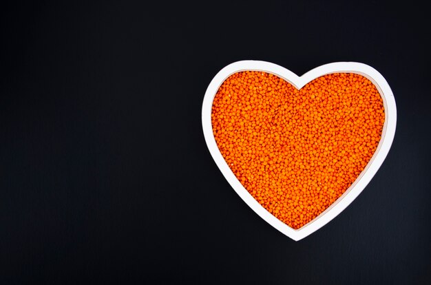 Delicious beans in a heart shaped plate