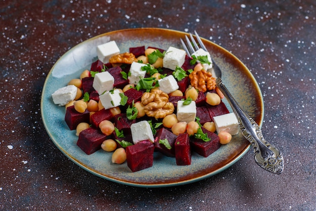 Delicious beet salad with feta cheese or goat cheese and chickpeas,top view