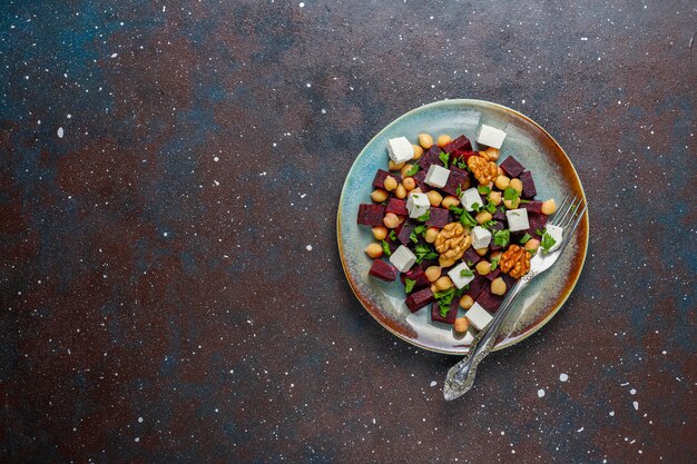 Delicious beet salad with feta cheese or goat cheese and chickpeas,top view