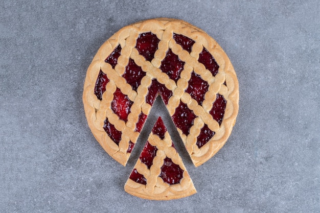 Delicious berry pie on marble surface