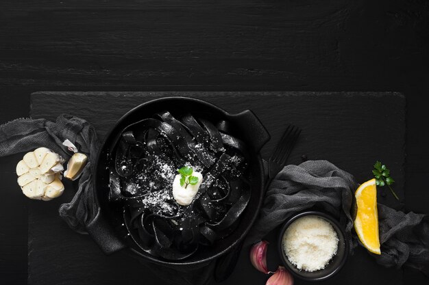 Delicious black pasta dish top view