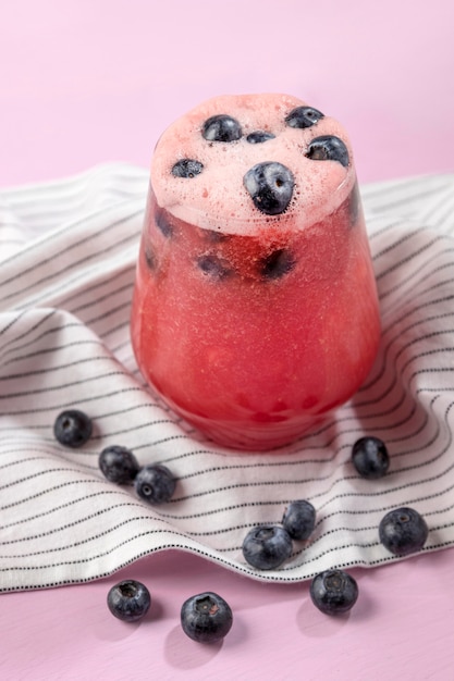 Free photo delicious blueberry drink glass high angle