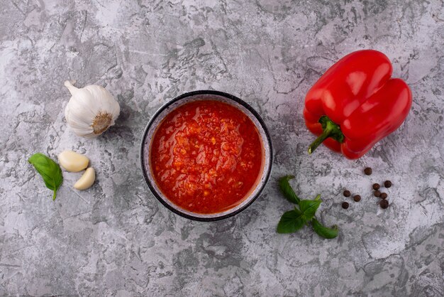 Delicious bowl with sauce top view