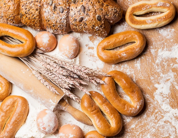 Delicious bread, bagels and eggs on the table