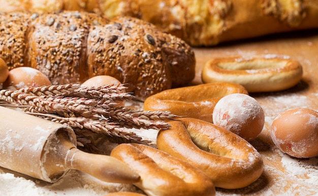 Delicious bread, bagels and eggs on the table