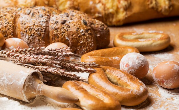 Delicious bread, bagels and eggs on the table