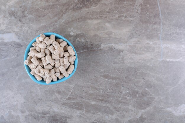 Delicious bread crumbs in the bowl, on the marble surface