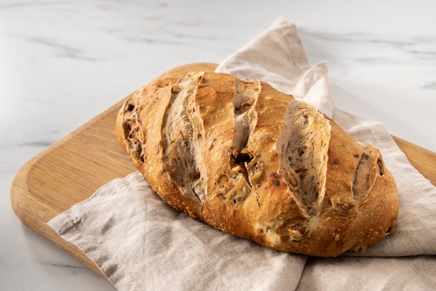 Delicious bread on cutting board