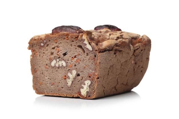 Delicious bread with walnuts on a white surface