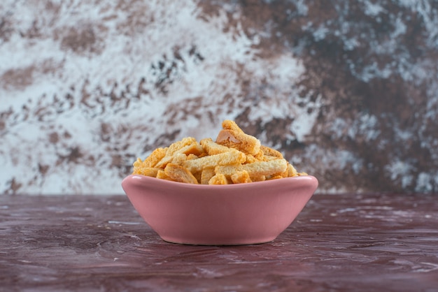 Delicious breadcrumbs in a bowl on marble. 