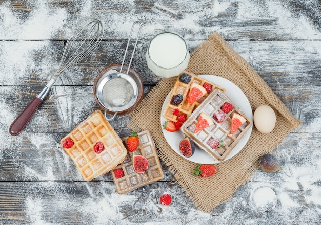 Delicious breakfast with waffles and fruits