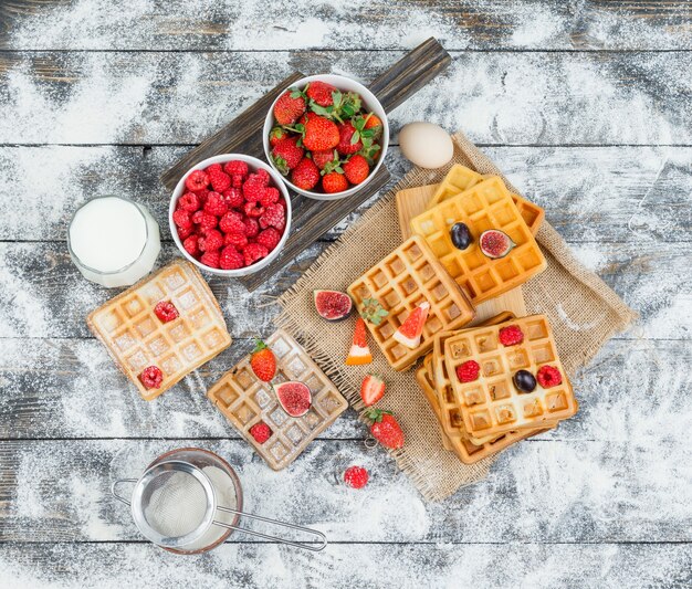 Delicious breakfast with waffles and fruits