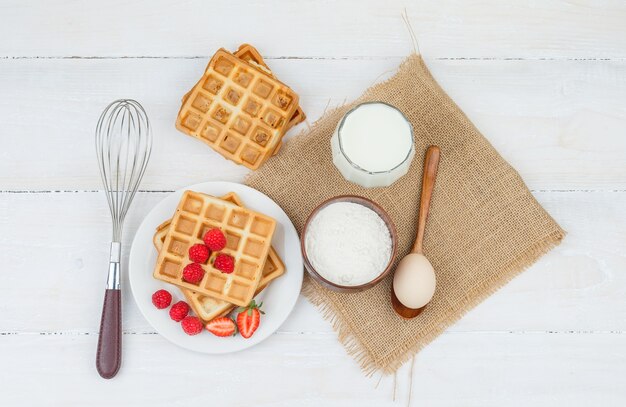 Delicious breakfast with waffles and fruits